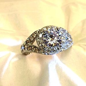 Brilliant cut white sapphire with cubics